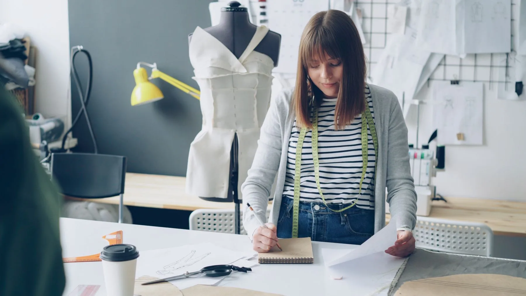 Fashion designer developing a garment in an atelier